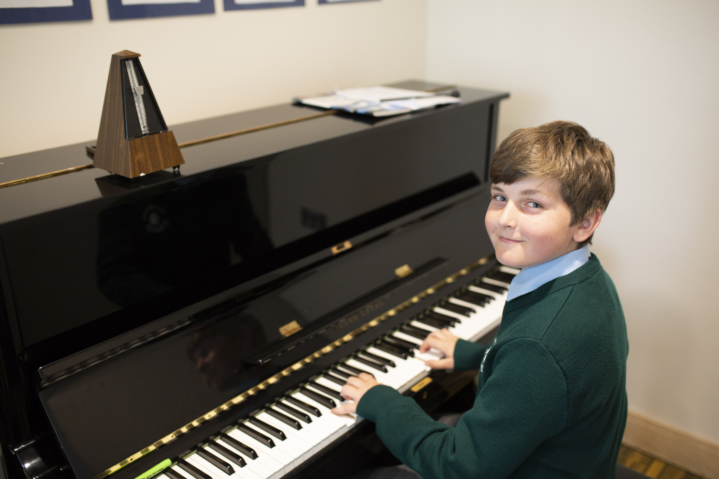 young boy playing piano