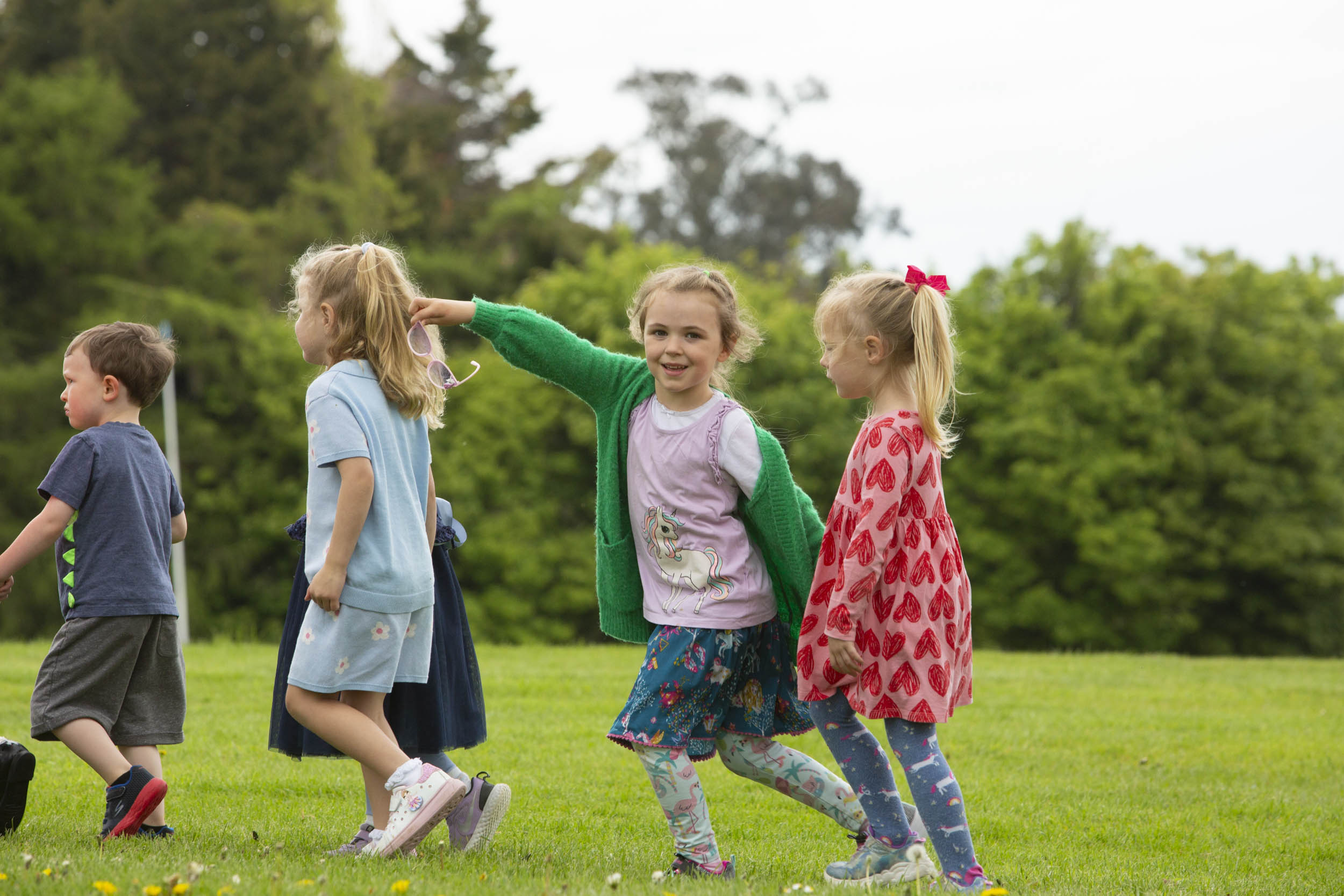 group of childrens walking outdoors